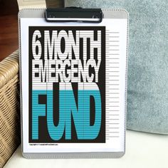 a clipboard with the words 6 month emergency fund on it