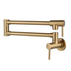 two brass colored faucets on a white background