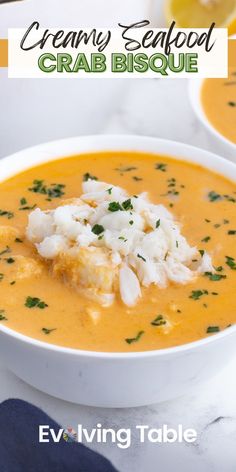 a bowl of creamy seafood crab bisque on a marble table with text overlay