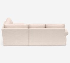 a white couch sitting on top of a hard wood floor