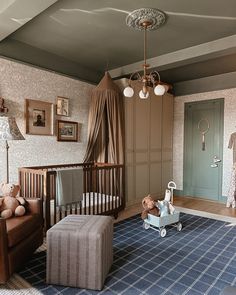 a baby's room with a crib, rocking chair and teddy bear on the floor