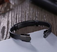 Keep it simple with this genuine leather, custom bracelet. It features a bar which can be engraved. Add names or meaningful words.  Perfect for dad or any man who's lucky enough to be on your list.  Length: 21cm/8.26" Modern Personalized Black Leather Bracelet, Black Leather Bracelet For Father's Day, Personalized Adjustable Rectangular Leather Bracelet, Personalized Black Leather Bracelet With Stainless Steel, Masculine Black Leather Bracelet With Stainless Steel, Personalized Leather Bracelet