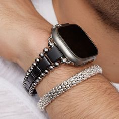 A LAGOS exclusive. One matte black ceramic smart Caviar watch band and one sterling silver skull Caviar beaded bracelet. Set includes size medium. Modern Gunmetal Jewelry With Bracelet Strap, Modern Silver Bracelet With Black Beads, Modern Silver Beaded Bracelet With Black Beads, Ceramic Watch, Skull Bracelet, Beaded Skull, Engraved Items, Black Ceramic, Bracelet Sizes