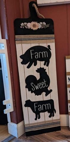 two farm signs are hanging on the wall