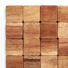 wooden squares are arranged on top of each other in order to form the same pattern