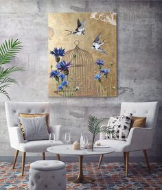 a birdcage with blue flowers and two birds in it is hanging on the wall