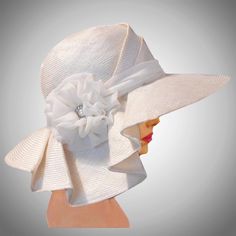 This couture hat was handmade on an antique hat block using a parasisal straw.  This is the large- wired-brimmed version of Sophia.  This lovely hat is embellished with silk georgette and a vintage button.   Please indicate your head size measurement when ordering (measure your head horizontally just above your eyebrows). When you receive your hat, there will be a small ribbon inside to fine-tune the fit, and a hat box for safe storage. Note: Colors will vary depending on your monitor and there Elegant White Fedora Straw Hat, Elegant White Adjustable Straw Hat, Elegant Sun Hat With Curved Brim In Toquilla Straw, Elegant Toquilla Straw Sun Hat With Curved Brim, Elegant Beach Cloche Sun Hat, White Toquilla Straw Hat For Garden Party, Elegant Cloche Sun Hat For Beach, Elegant Beige Cloche Hat For The Beach, Elegant Beige Cloche Hat For Beach