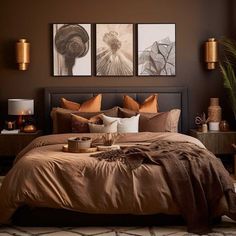 a bedroom with brown walls and pictures on the wall above the bed, along with an area rug