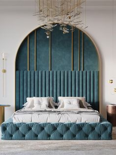 a large bed sitting in the middle of a room next to a blue headboard