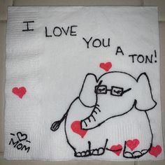 i love you a ton towel with an elephant on it and hearts in the background