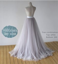 a white dress on a mannequin with the words, 600 colors any size