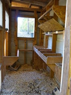 the inside of a building that is being built with wooden beams and plywood flooring