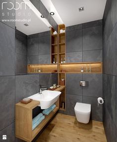 an image of a bathroom with grey walls and wood flooring on the bottom right hand corner