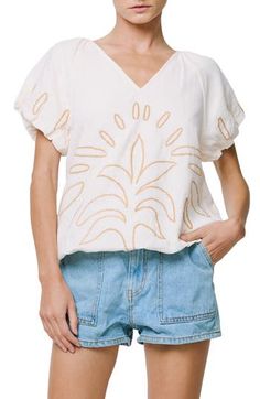 Abstract embroidery enlivens a blousony cotton top framed by puffy raglan sleeves. 21 1/2" length Back keyhole with button-and-loop closure V-neck Short sleeves 100% cotton Hand wash, dry flat Imported Asian & Pacific Islander Owned/Founded Cotton Tops With Blouson Sleeves In Relaxed Fit, Cotton Puff Sleeve Top With Floral Embroidery, Spring Cotton Top With Raglan Sleeves, Spring Cotton Raglan Sleeve Tops, Casual Cotton Tops With Blouson Sleeves, Spring Embroidered Blouse With Balloon Sleeves, Casual Embroidered Puff Sleeve Blouse, Spring Embroidered Balloon Sleeve Blouse, Spring Embroidered Puff Sleeve Top