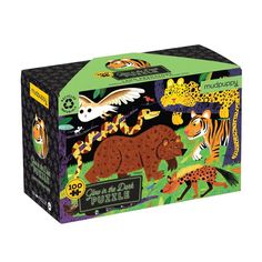 a puzzle box with animals and birds on it's front, in the shape of a jungle scene