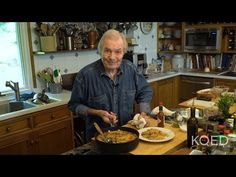 a man standing in a kitchen preparing food