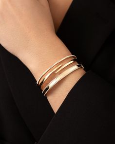 14k solid gold Width at widest point: 3.8 mm Width at shortest point: 1.9 mm Oval, hinged bangle with safety latch Luxury Diamond Bangle Gold Bracelet, Luxury Classic Bangle With Prong Setting, Luxury Classic Hinged Bangle, Gold Bangle Modern Design, Modern Gold Bracelet For Women, Modern Gold Bangles For Women, Modern Gold Bracelet, Modern Gold Jewelry Unique Designs, Diamond Bracelet Design Unique