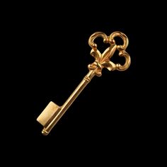 a golden key with a heart on it