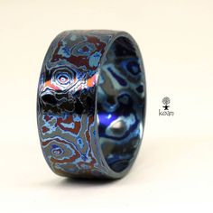 "This is a unique mokume gane ring, made with 40 layers of 2 grades of Titanium and Zirconium. Koan mokume gane jewellery My name is Andrew Seginovich, designer, maker and creator of Koan Mokume gane Jewelry. Welcome to my shop! The studio was created in 2005, and since that time I've been seeking the most interesting, inspiring and beautiful designs to make you happy. I hope you will enjoy my work and I promise to do my best to make you satisfied. The main technique I work in is mokume gane - w Unique Patina Rings As Gift, Modern Etched Rings, Mokume Gane Ring, Wooden Texture, Mokume Gane, Rainbow Fashion, Textured Ring, Custom Ring, Ring Minimalist