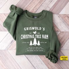 Get into the festive spirit with the Griswold's Tree Farm Since 1989 Shirt, the perfect Christmas T-shirt for celebrating the holiday season! Whether you're looking for a fun family holiday shirt for matching outfits or a stylish yet cozy Christmas outfit for your next gathering, this shirt is a great choice. Its nostalgic design, inspired by a classic tree farm theme, makes it ideal for a Christmas party tee or even a thoughtful Christmas gift for friends and loved ones. Celebrate the joy of th Farm Fresh Christmas Trees, Griswold Christmas, Christmas Tree Graphic, Winter Apparel, Womens Christmas Shirts, Fresh Christmas Trees, Hallmark Christmas Movies, Christmas Tree Shirt, Tree Shirt