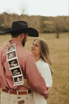 a man in a cowboy hat hugging a woman