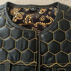 It Is Black And A Goldish Yellow. It’s Called The Hornet.. It Has A Gun Holster And Pockets Inside The Vest And Also A Section To Put A Back Pad For Safety When You’re Riding Fitted Black Leather Jacket With Patchwork, Riding Vest, Hornet, Inside Pocket, Mens Jackets, Jackets & Coats, Conditioner, Brand New, Yellow