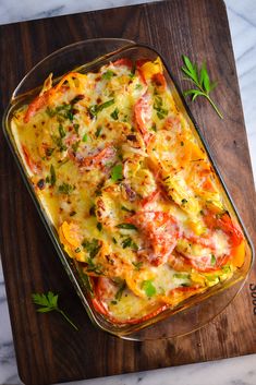 a casserole dish on a wooden cutting board