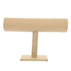 a beige table lamp with a wooden base and fabric covering on the top, against a white background