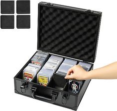 a black briefcase filled with lots of cards and two sets of dicer's