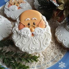 cookies decorated like santa claus on a plate