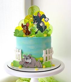 a cake decorated with cartoon characters on it