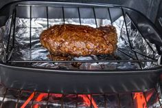 steak cooking on the grill in an outdoor oven