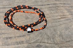 Made with a vibrant mix of 11/0 (small-size)  seed beads in orange, black and purple glass seed beads, with the addition of a Halloween them Clay bead charm on one bracelet. **Please note that due to charm availability specific charm upon receipt will vary. See variations in listing pictures** Made with strong stretchy material, doubled knotted and glued.  Add a subtle halloween touch to your outfit or add to an addition to an existing set. This listing is for a set of FOUR bracelets. **Please measure your wrist with a piece of string prior to ordering to ensure the correct fit.* Take into account if you prefer a loose or tighter fit. See size guide for instructions.** Note- due to the dying process some bead colors may fade over time. Follow all care instructions for bracelet longevity. Halloween Black Adjustable Beaded Bracelets, Adjustable Black Beaded Bracelets For Halloween, Halloween Black Bracelets With Round Beads, Black Round Bead Bracelets For Halloween, Black Stretch Bracelet With Round Beads For Halloween, Black Round Beaded Bracelets For Halloween, Black Tiny Beads Bracelets For Festival, Black Beaded Bracelets With Tiny Beads For Festival, Black Festival Bracelets With Tiny Beads