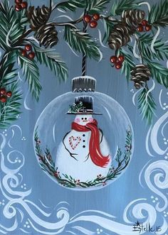 a snowman ornament hanging from a tree