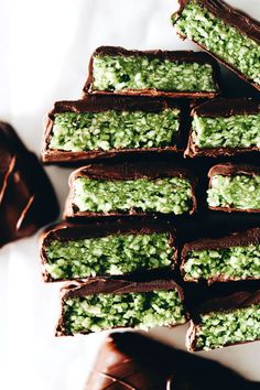 there are many pieces of chocolate with green toppings