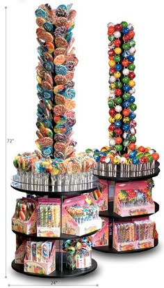 an assortment of candies on display in a round rack with the measurements for each item