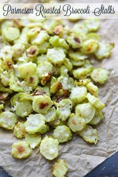 roasted brussel sprouts on parchment paper with text overlay that reads, parmesan roasted brussel sprout stalks