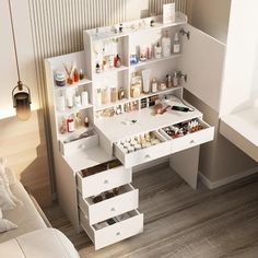 a white desk with lots of drawers and bottles on it