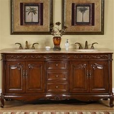 a double sink vanity with two mirrors above it and an area rug on the floor