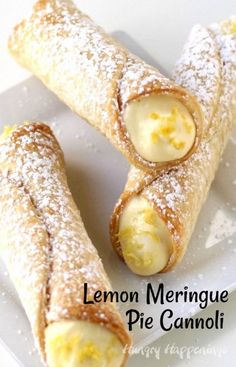 two lemon meringue pies on a plate with the words cannoli