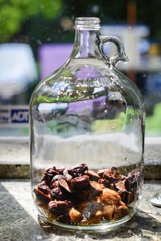 a glass bottle filled with lots of food