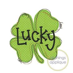 a shamrock with the word lucky on it's side and an image of a bee sitting