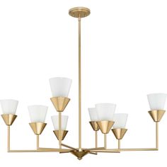 a brass chandelier with white glass shades