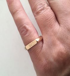 "Pinky ring, Engraved ring, Initial Ring, Personalized Ring, Stacking Ring The ring made of Best quality 18k Gold Plate Engraved letter/s, word, name in any language Choose your size , and your word / name - in any language let me know in the \"note to seller\" during checkout what you want. The product will arrive to you packed in gift box and padded envelope to maintain the product Our jewelry are water resistant and comes with 1 year warranty Thank you for your interest. Please check out our Adjustable Initial Ring For Anniversary, Minimalist Initial Ring With Engraving For Promise, Adjustable Open Signet Ring For Promise, Modern Engraved Ring For Gift, Modern Engraved Ring As Gift, Adjustable Open Signet Ring For Promises, Modern Engraved Ring For Wedding, Yellow Gold Hand Stamped Promise Ring, Simple 14k Gold Engraved Ring For Anniversary