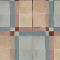 a tile floor with different colored squares on it