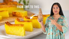 a woman holding a piece of bread in front of some pieces of cake on a plate