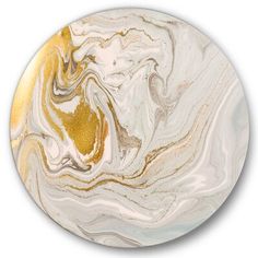 a white and gold marbled plate on a white background, with an abstract design in the center