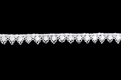 a white lace trim on a black background