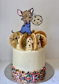 a cake decorated with cookies and cookie doughnuts