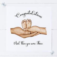 a card with two hands holding a baby's feet and the words congratulations and then you were once